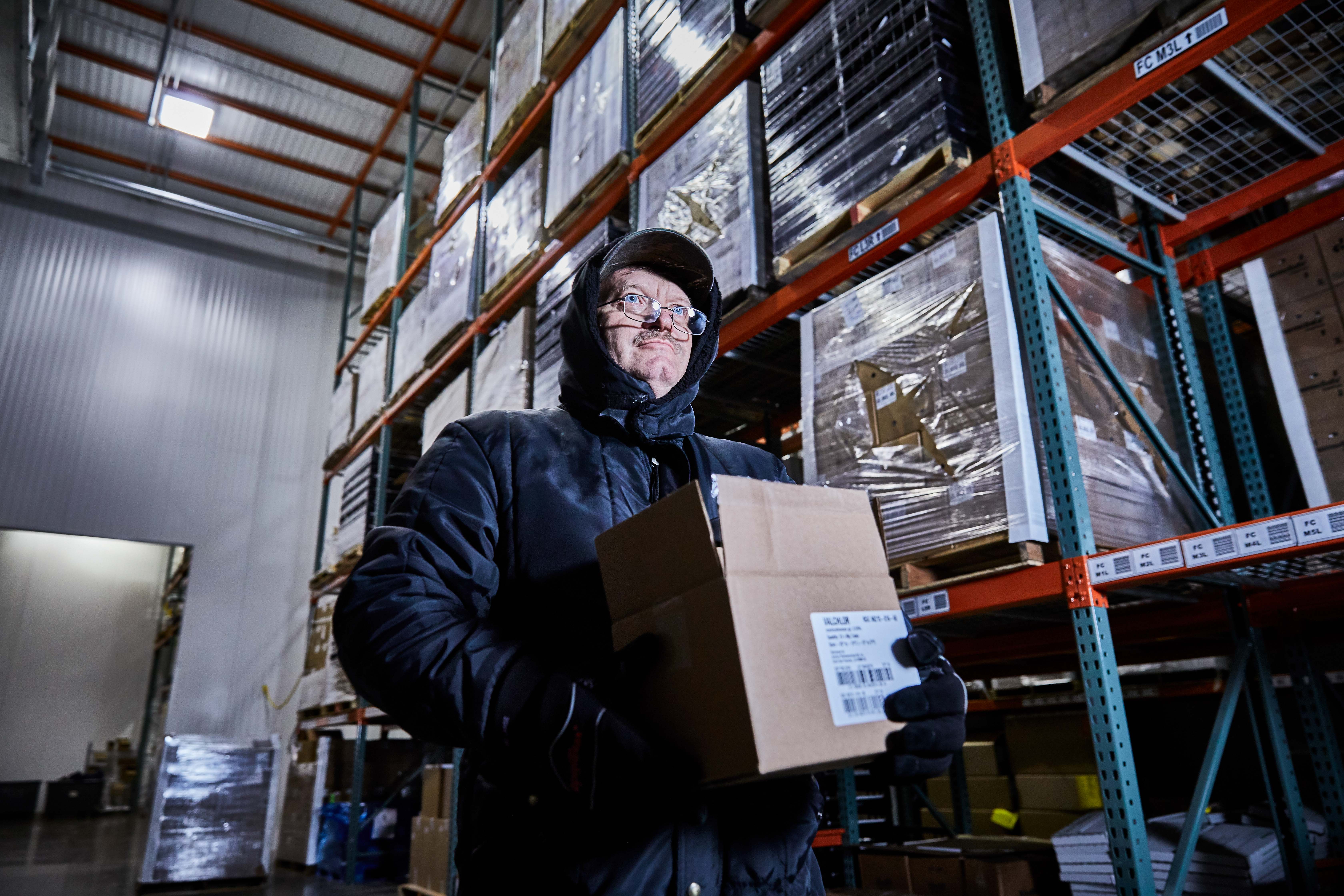 Associate in a parka working in the freezer of our Louisville Distribution Center