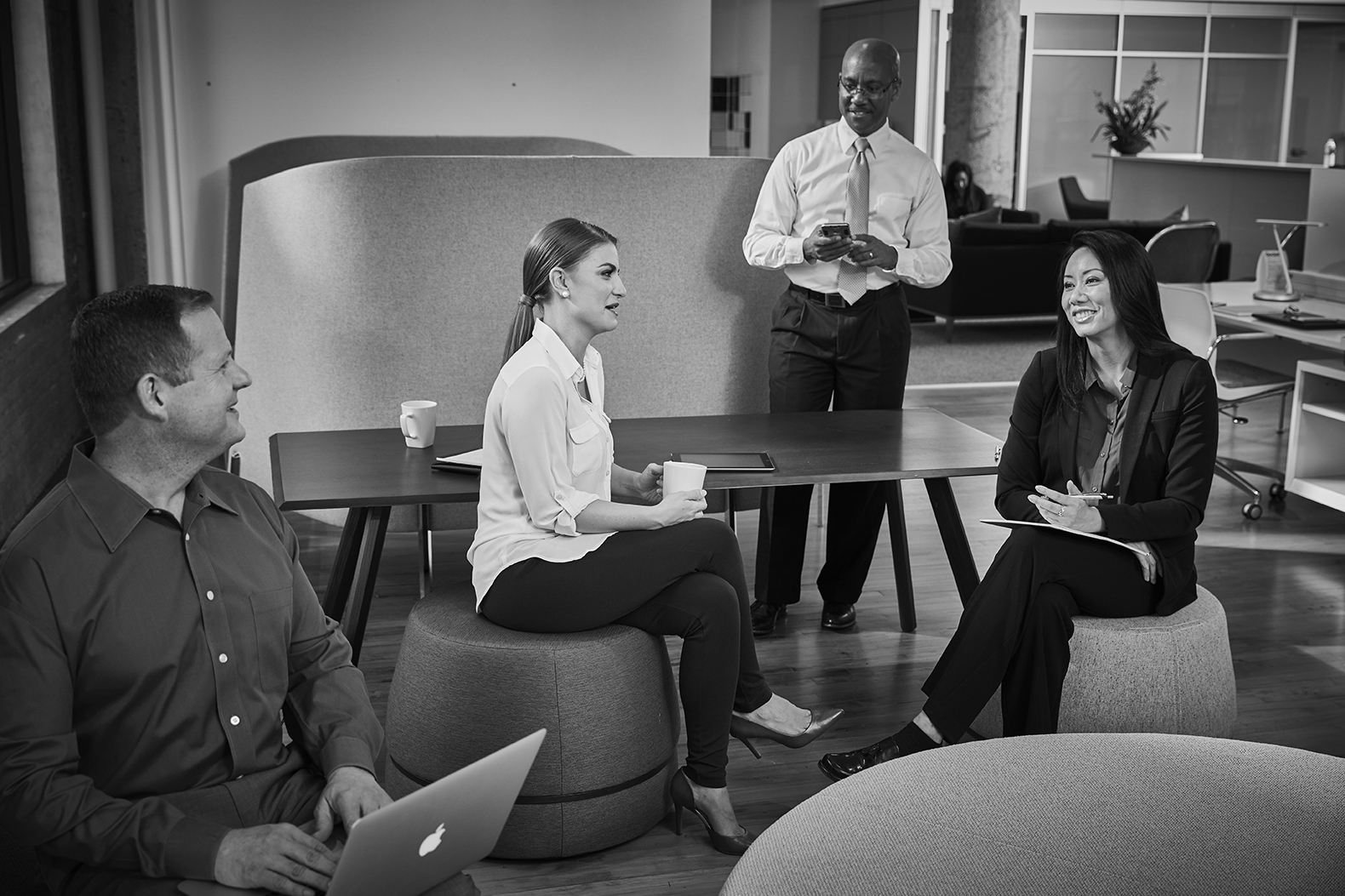 Associates meeting in the kitchen area