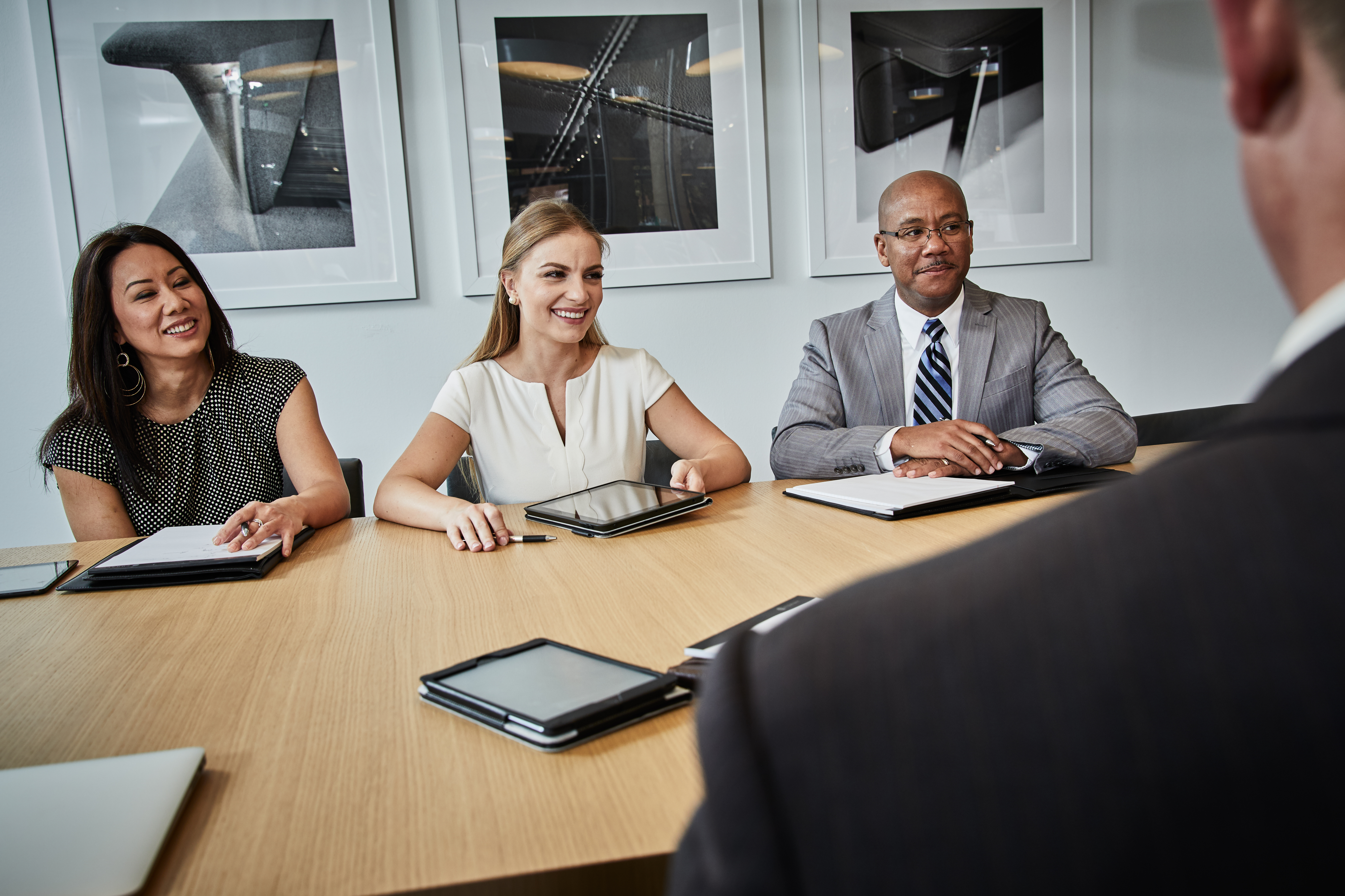 Associates meeting in a conference room