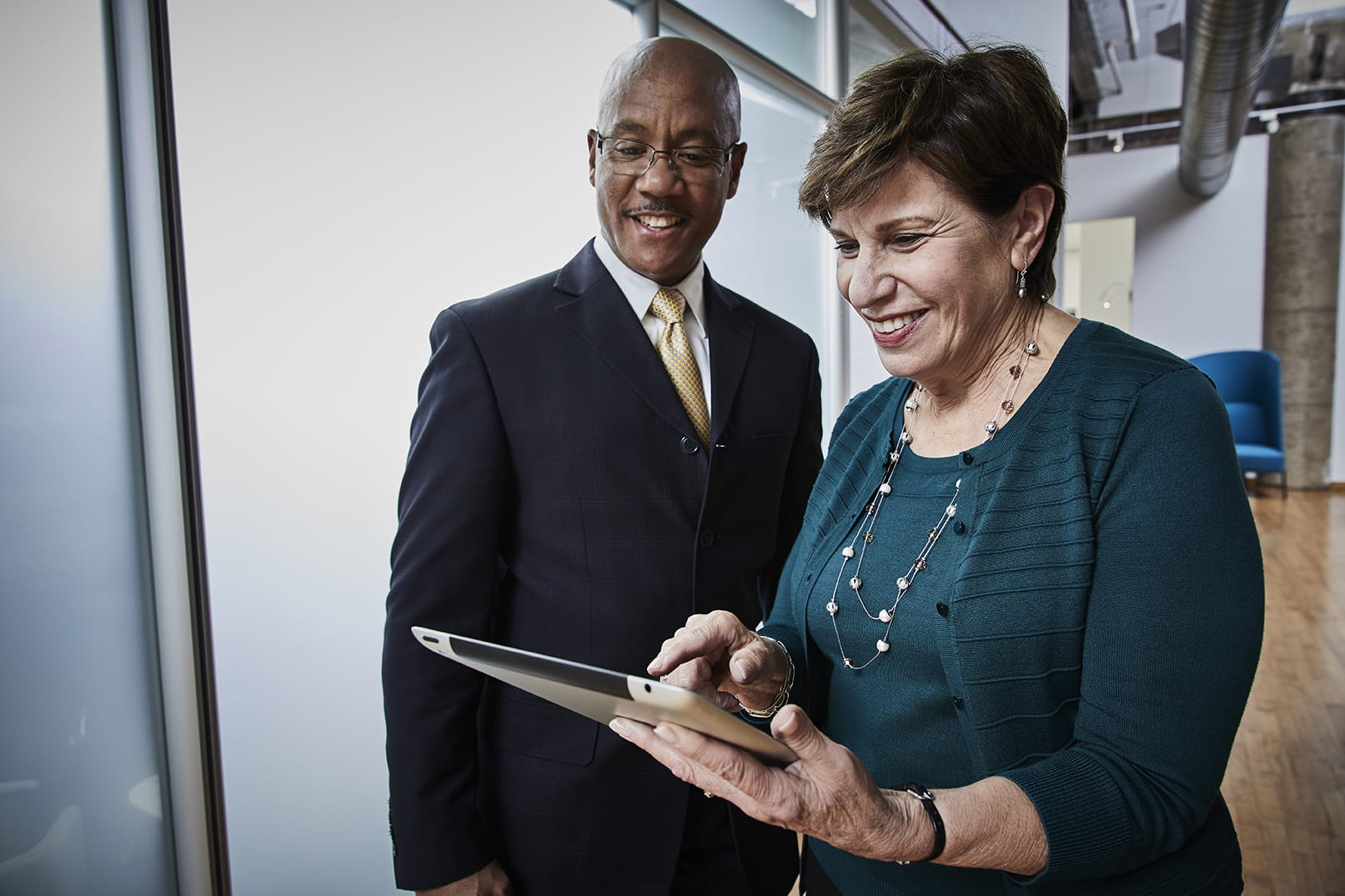 Associates viewing a tablet