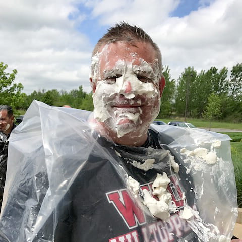 Associate has been pied in the face
